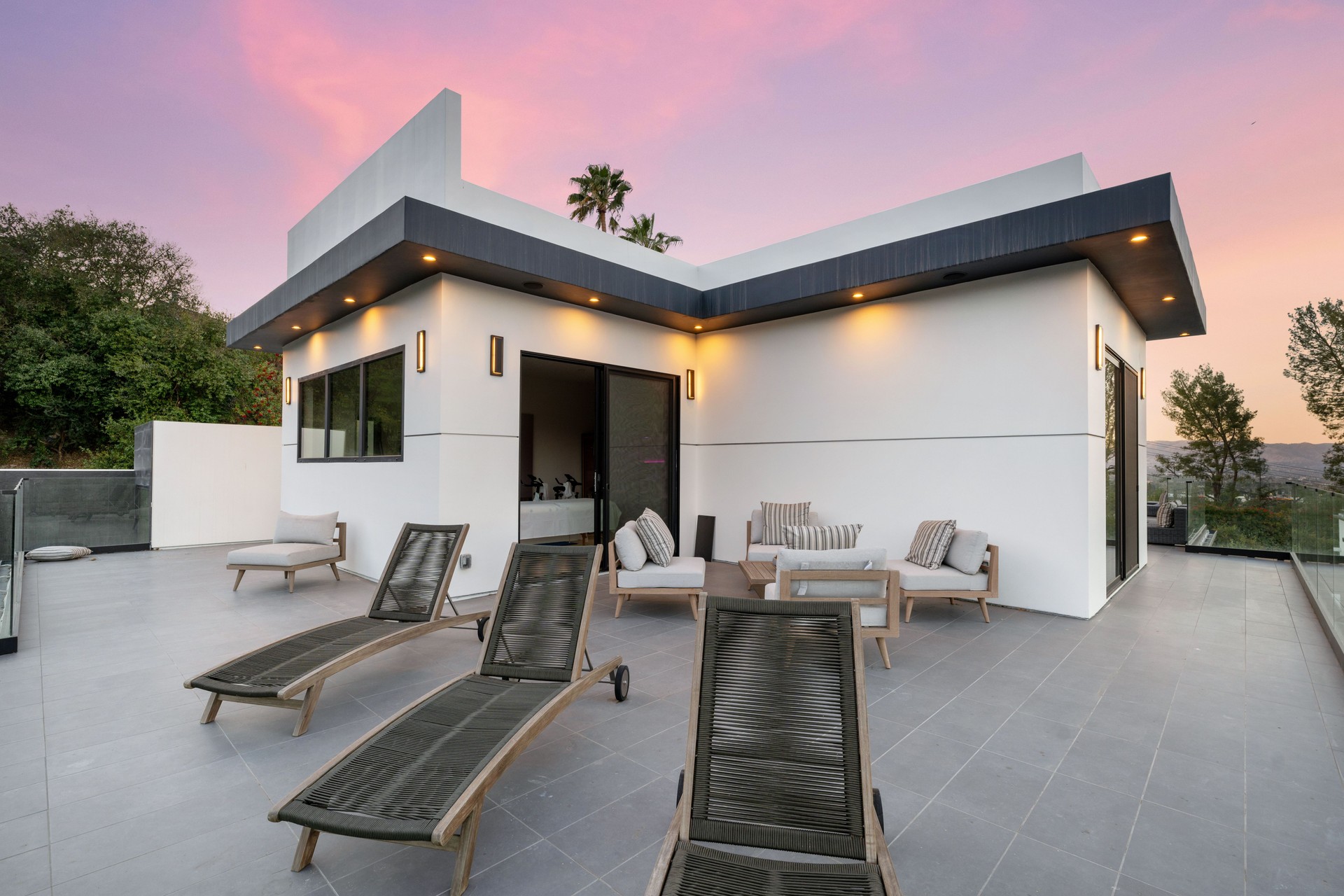Luxury Outdoor Patio with Pool, Stylish Seating, and Sunset Views